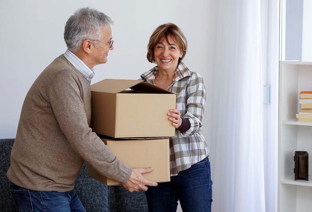 Senior couple moving into a new apartment.