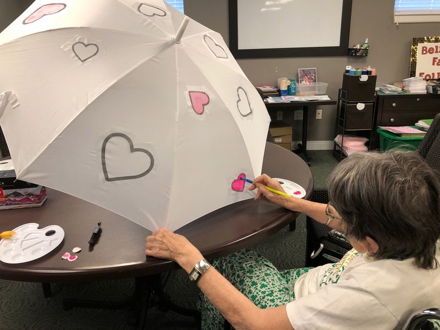 Belmont Village Glenview resident paints umbrella