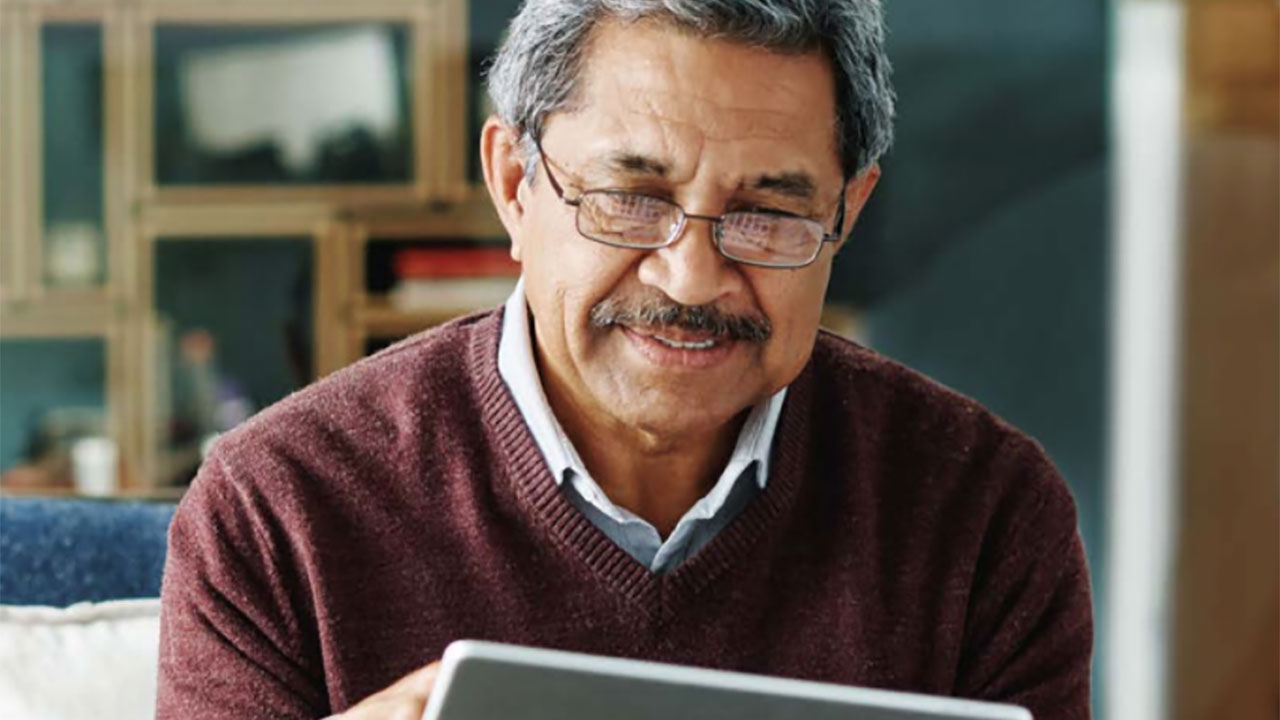 Senior man looking at tablet