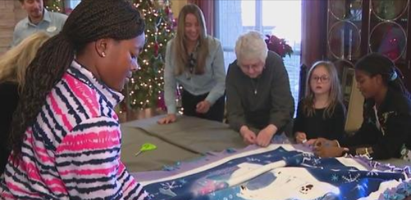Seen On FOX 10 | Seniors make blankets with students