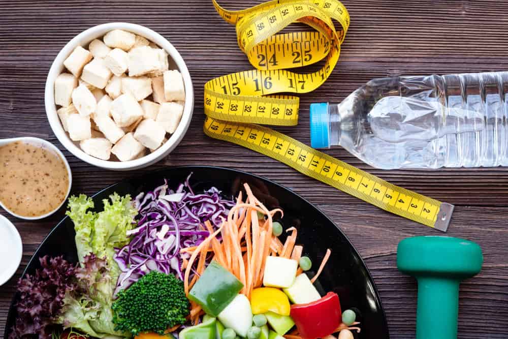 An assortment of food paired with items associated with weight loss