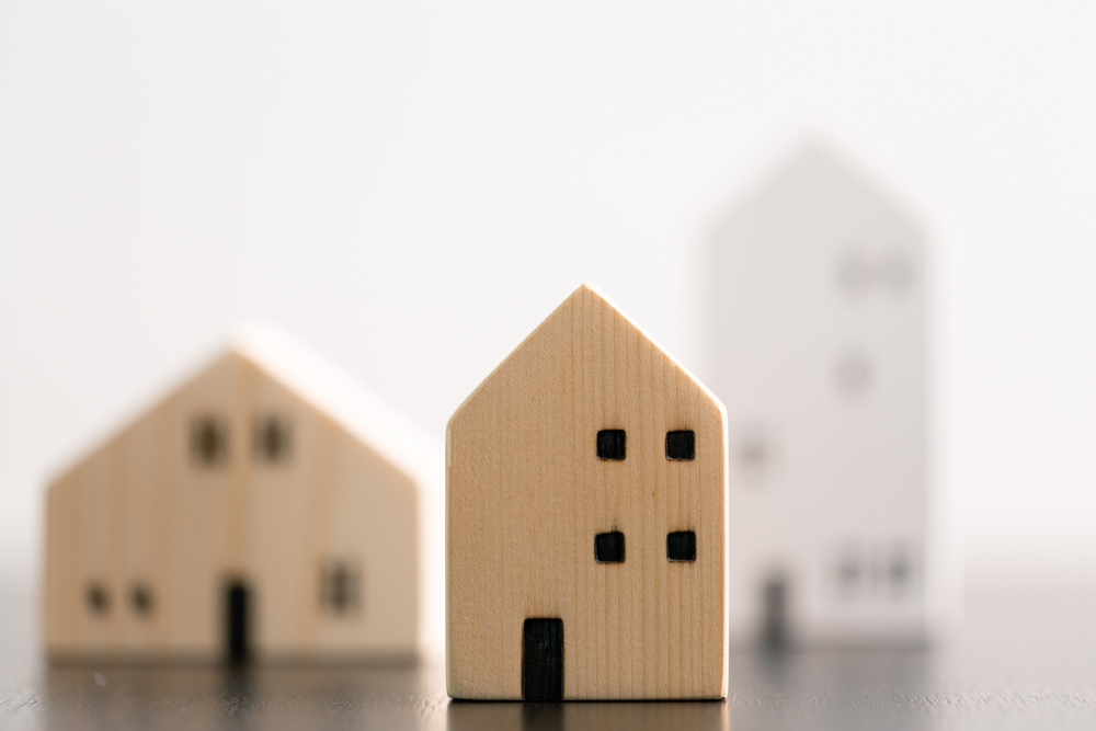 A collection of wood carvings shaped into houses