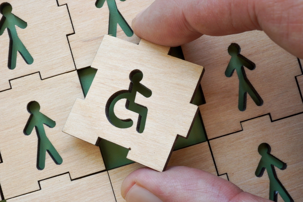 A puzzle piece with an accessibility symbol printed on it